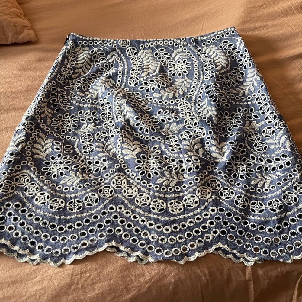 Loft "blue denim-like color" size 4 skirt.  Embroidered leaf eyelet scalloped.